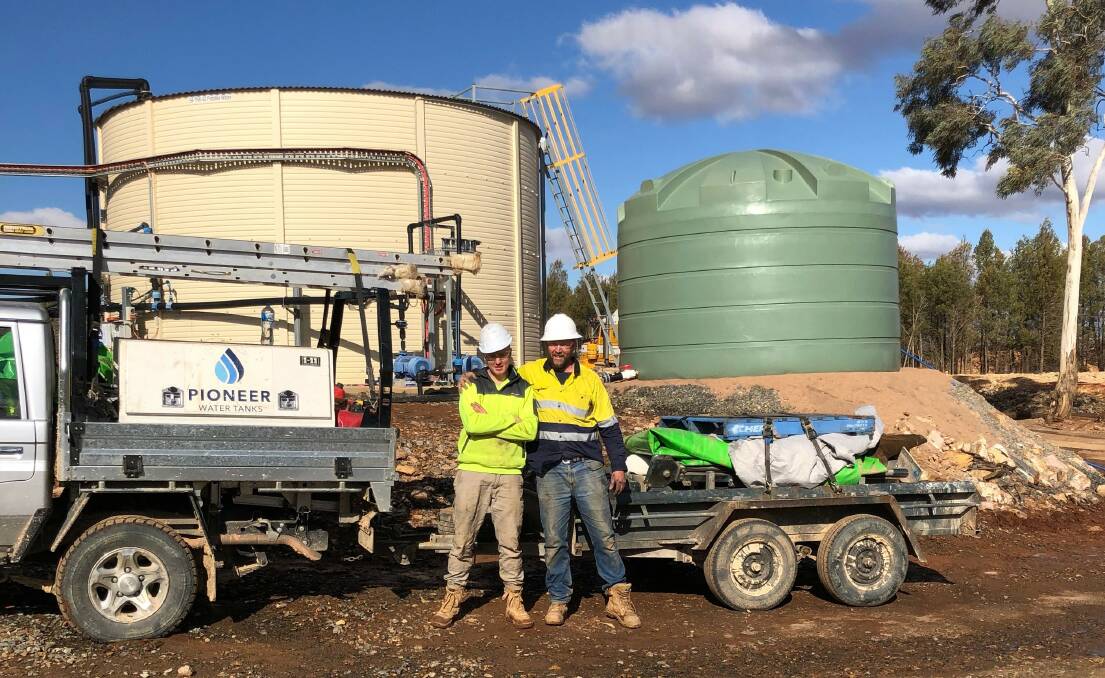 FAMILY BUSINESS: Father/Son duo Jack and Richard Holloway help their local community by not only preserving fresh rain water but also Aussie jobs.