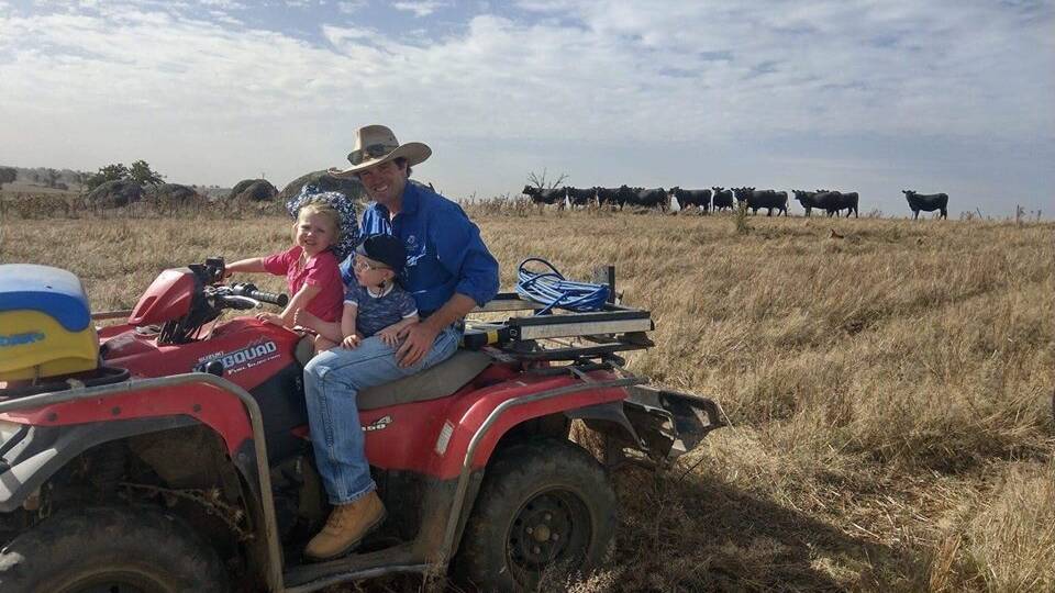 A FAMILY AFFAIR: Brad Cavanagh with his two children Olive and Henry at his renowned cattle stud Hardhat Angus on Lynwood.