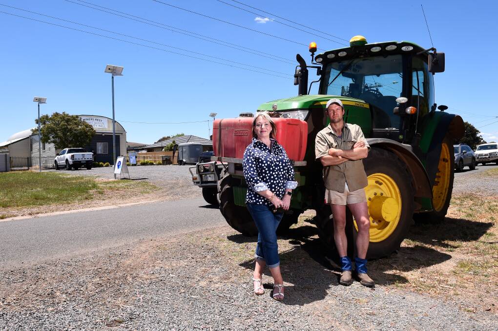 STATEMENT: Cate Lancashire and Chris Stephens share their voices in the tractor parade through Miners Rest on Sunday in a stand against the Western Victoria Transmission Network Project. Picture: Adam Trafford