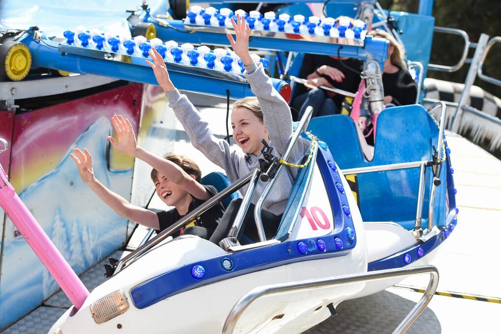 Rides are off: Mulwala residents Cooper Webster, 10, and Lilaha Ormsby, 14, enjoy a thrill at last year's Wangaratta Show. Sadly the COVID-19 pandemic has claimed this October's event. Picture: MARK JESSER 