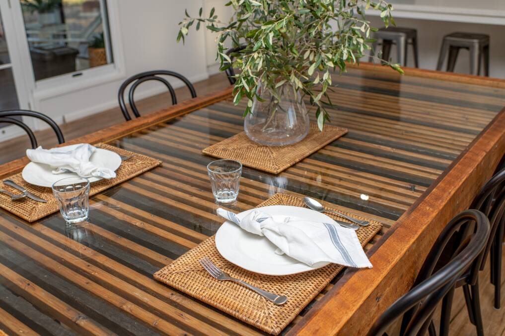 A wool classing table restored into a stunning dining room table by Porter and Wood. Photo: Ange Stirling Photography.