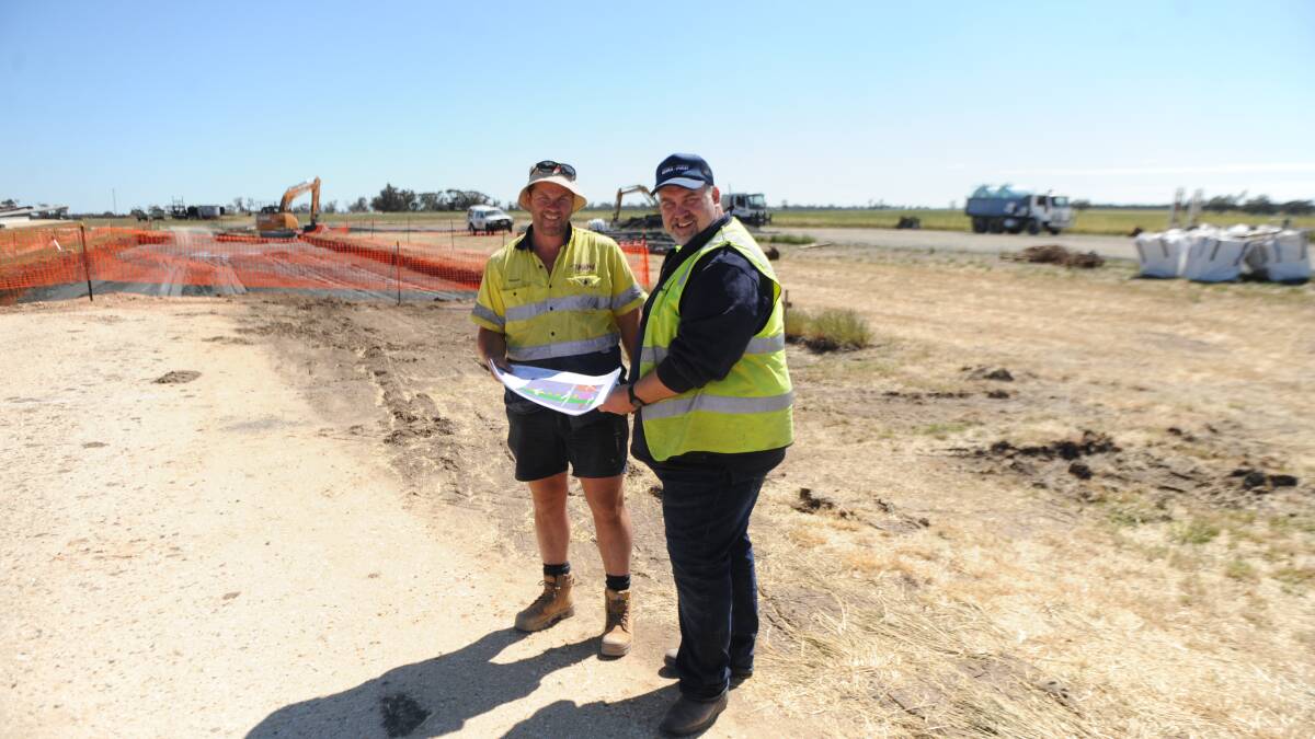 EXPANDING FOR EFFICIENCY: KLM Concreting's Travis Mackley looks over upgrade plans with Wimpak's James French. Picture: ALEXANDER DARLING