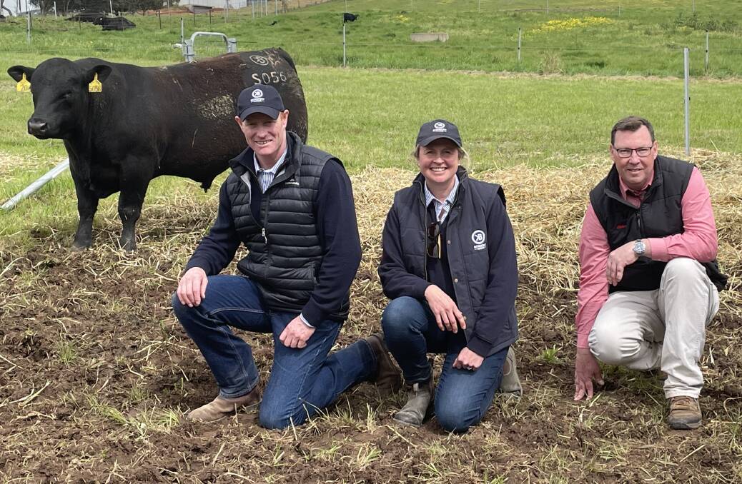 Sam and Jane King, Bowmont Angus, Tatyoon, with Elders Victoria and Riverina stud stock manager Ross Milne, and the top-priced bull.