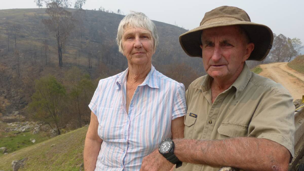 JOB TO DO: Robin and Mack Stagg, Tambo Crossing, stand in one of their paddocks in East Gippsland destroyed by fire but are already planning their recovery.