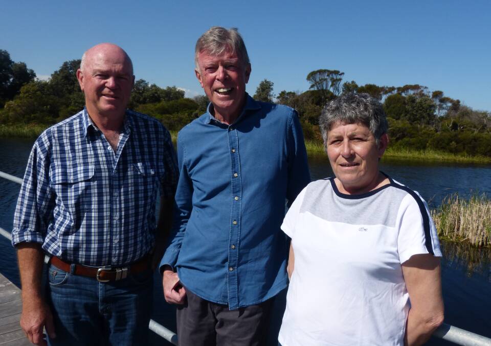 FRIENDS: Retired agent Rod Draper with Yancowinna principals Dennis Ginn and Christine Gicquel at the Yancowinna wetlands at Cape Paterson.