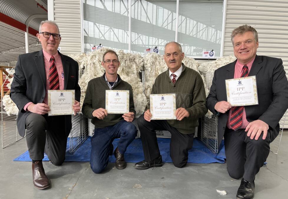 RECOGNITION: Elders wool selling centres manager Simon Hogan, Matt and Everard Linke, and Elders Hamilton district wool manager Andrew Howells in Melbourne.