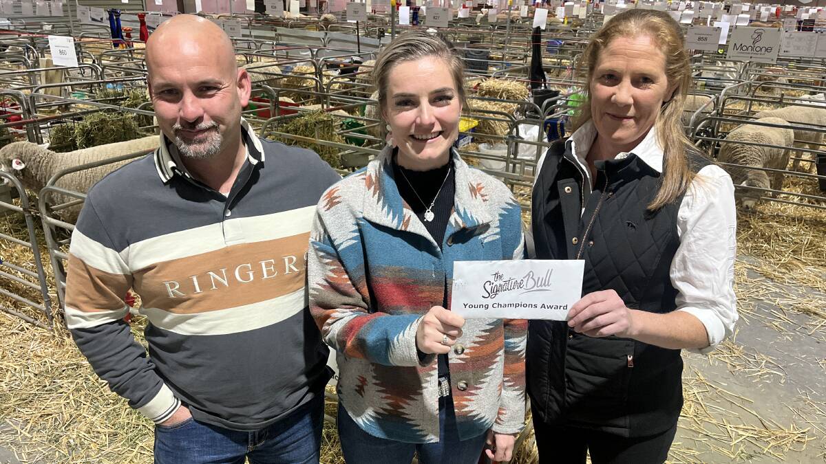 Signature Bull directors Gavin McNulty and Kristel Barrow present Charlotte Close (middle), Baranduda, with the Young Champions Award at the Australian Sheep & Wool Show. Picture by Bryce Eishold