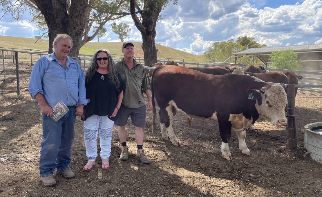 Nunniong Hereford stud principal Phillip 'Bluey' Commins, Ensay, with local breeders Kerry and Phil Geehamn, Ensay, who bought Lot 11 for $11,000. Pictures by Bryce Eishold