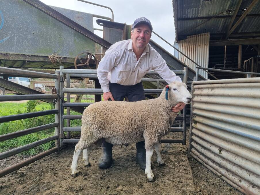 Cashmore Oaklea stud co-principal John Keiller, Cashmore, with the sale-topper, a maternal ram that made $11,200. Picture supplied