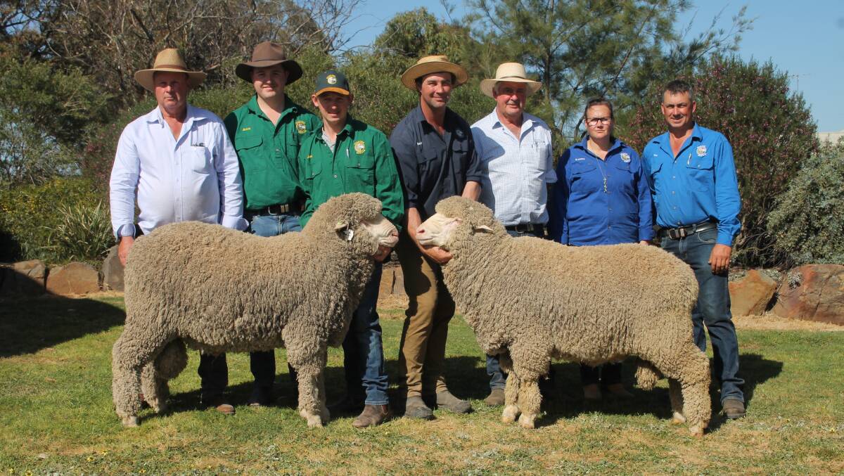 Roger Polkinghorne, Jesse Wandel and Josh Turnbull, Charinga Merinos, Berrimal, Brent Flood and Karina and Tim Polkinghorne, Banavie Merinos, Marnoo and Andrew Calvert, Wool Solutions, with top-priced rams Lot 57 Caringa 220657 and Lot 2 Banavie 220223 which sold for $17,000 and $30,000. Picture by Philippe Perez