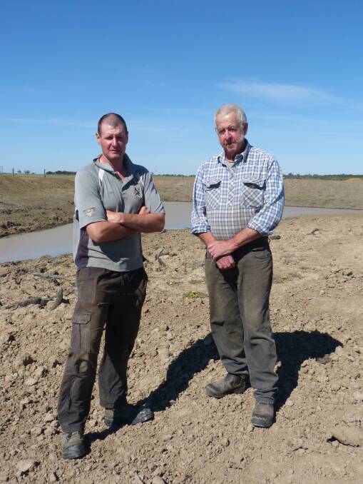 DRY: Tim and Bill Waite stand near a dam on their property at Glengarry East.