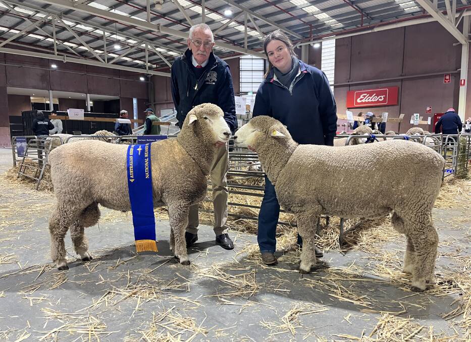 RECOGNISED: Peter Baker, Loddon Park Corriedale stud, Baringhup, with his national Corriedale pair of rams. Pictured with handler Lilly Collins, Black Forest Corriedale stud, Gisborne, and the 12-month-old rams.