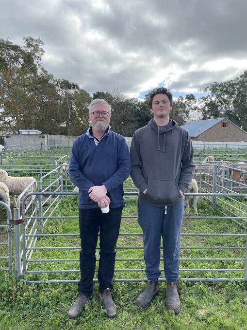 CHECKING PRICES: Anthony and Archie Mackay, Woodside, SA, were browsing for sheep at the recent Mount Pleasant, SA, market.