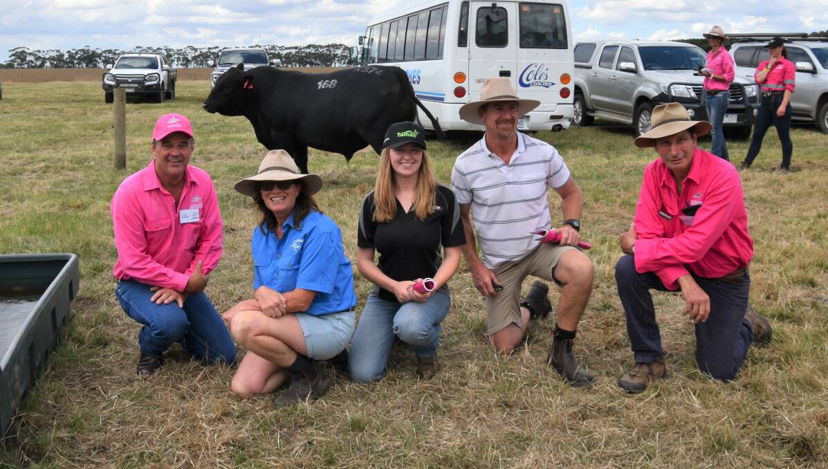 Te Mania Angus stud co-principals Tom Gubbins and Hamish McFarlane flank the buyers of the top Angus lot at $130,000, Jodie, Claire and Shane Foster, Boonaroo Angus, Comdale.