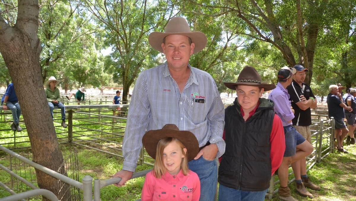 IN FOCUS: Nathan Everingham of Nathan Everingham and Co, Finley, NSW, with children Ruth, 6, and Noah, 13, pictured at the Deniliquin, NSW, store sheep sale.