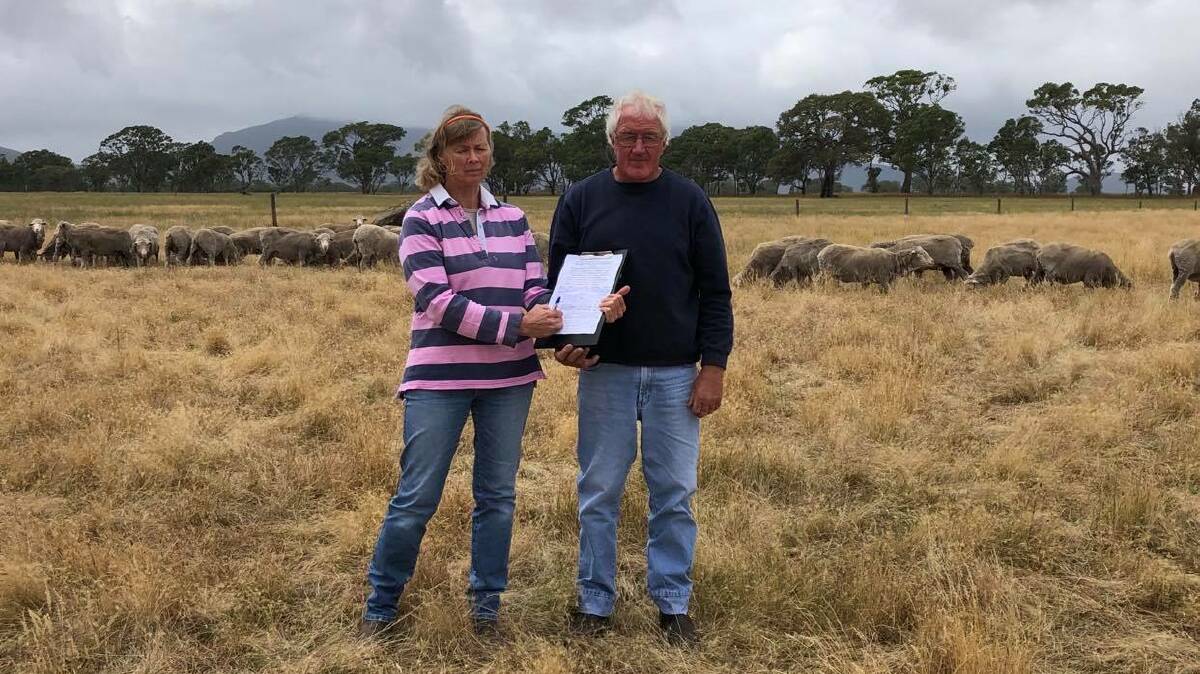 OUTRAGE: Primary producers Rhonda and John Crawford, Victoria Valley, with the petition. The Crawfords run Rockbank Merino and Poll Merino stud.