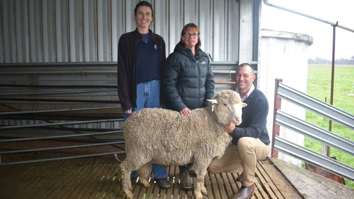 Top-priced Toland Poll Merinos buyer Edwina Sleigh, Ruffy, Anna Toland and Simon Riddle, Toland Merinos, Violet Town, with one of the two top-priced rams.