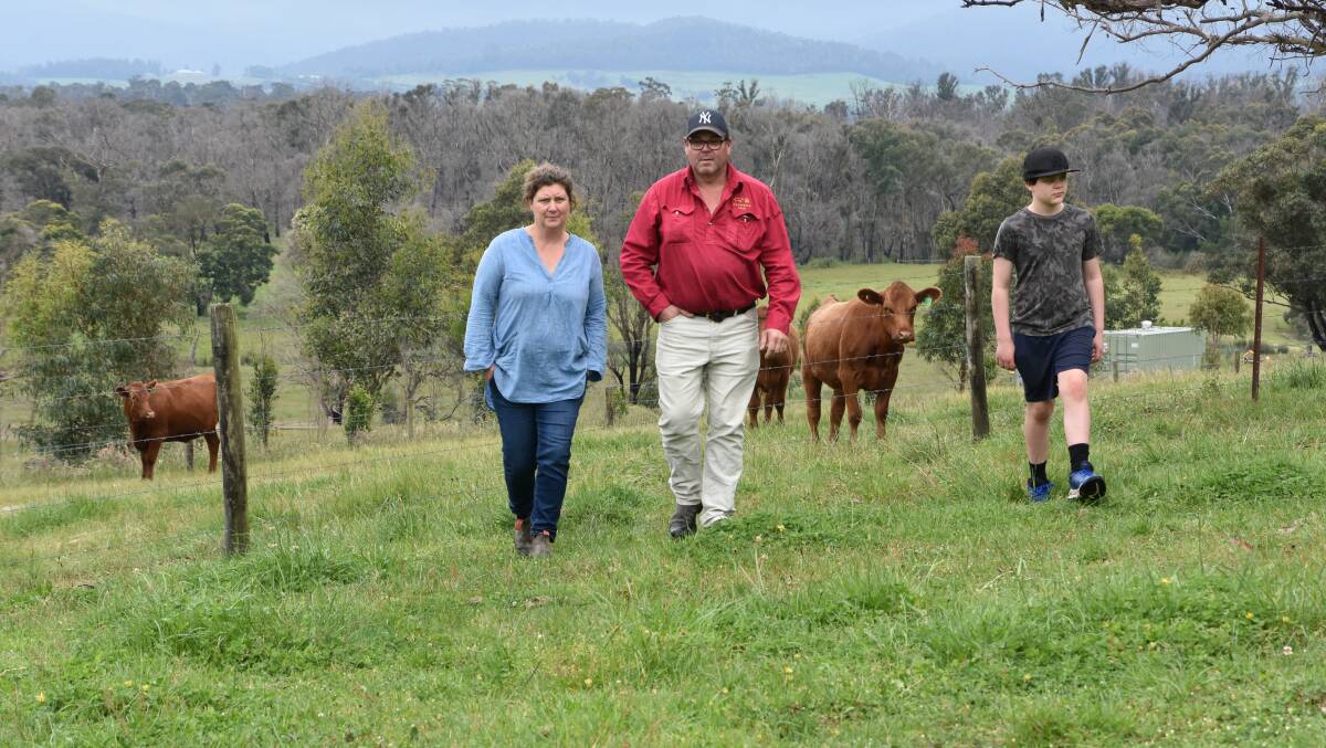 PLEA: Kate Birch, Jillangolo Park, Tonimbuk, with husband Mark Henneysee and son Billy, 11, has called for fire recovery funding to be reassessed. 