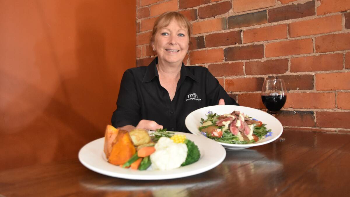 HEARTY: Marong Family Hotel owner Robyn Lougoon with a few of the paddock-to-plate lamb dishes she offers.