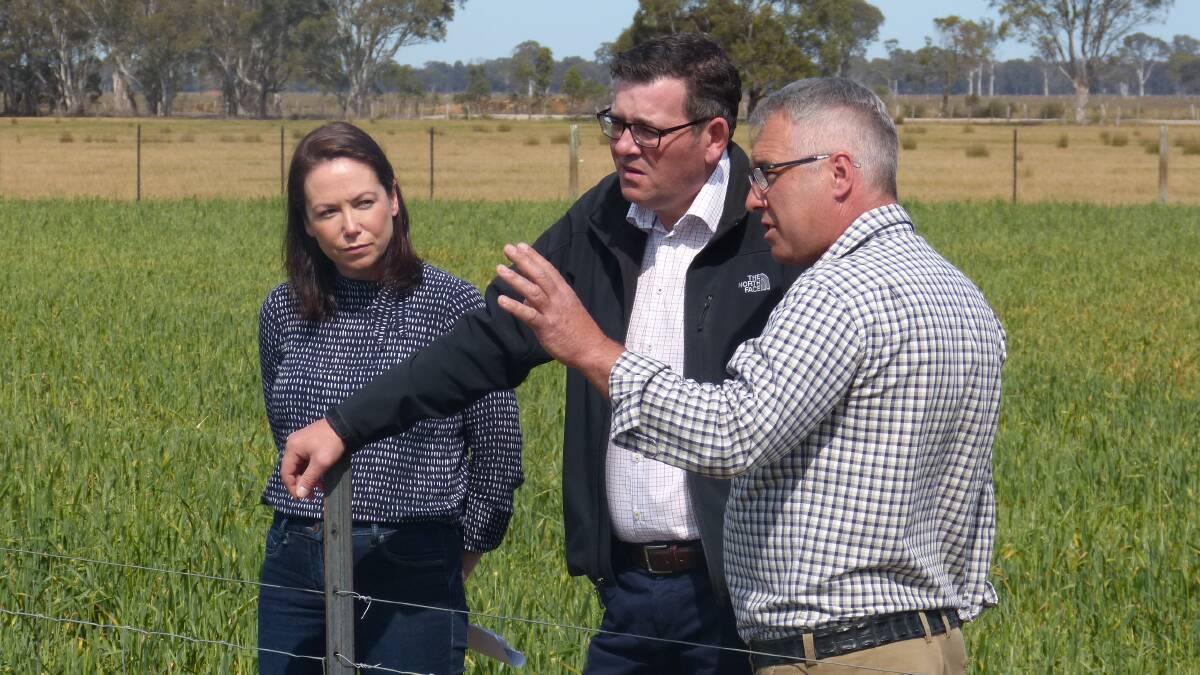 DROUGHT FUNDING: Agriculture Minister Jaclyn Symes and Premier Daniel Andrews with Bairnsdale producer Trevor Caithness during a visit to East Gippsland in October.