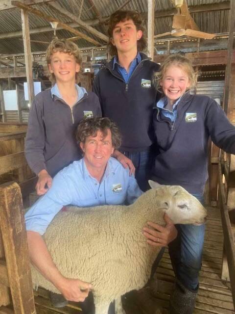 Chris Harry Rupert and Bridie Dorahy with equal top price ram Lot 17 purchased by Vicky Geddes, Yallock, Holbrook, NSW 2644. 