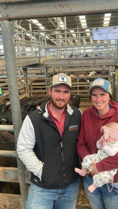 HUGE RESULT: Vendors Charlie Hengstberger and Jordi Stockdale, Mardan, sold 13 bucket-reared Angus/Friesian-cross steers, 200-230kg, for $1590 at Leongatha on Friday. Pictured with daughter Lacy. Photo by SEJ.