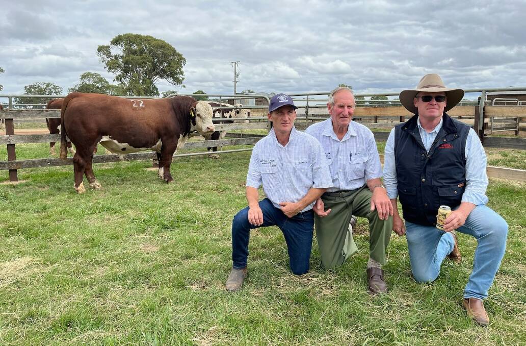 Nathan Roberts and David Lyons, Melville Park Hereford stud, Vasey, and Stephen Peake, Bowen Poll Herefords, Barraba, NSW, with the $26,000 bull, Melville Sam. Picture supplied