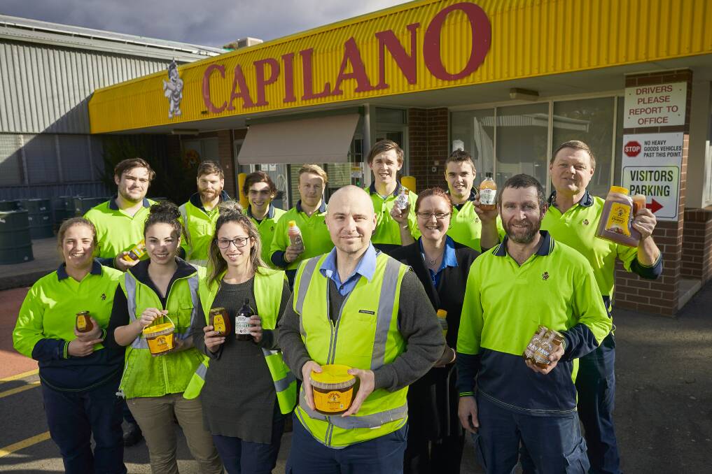 Chinese whispers: Staff and operations manager Michael Notley of Capilano Honey outside the Maryborough plant. Picture: Luka Kauzlaric