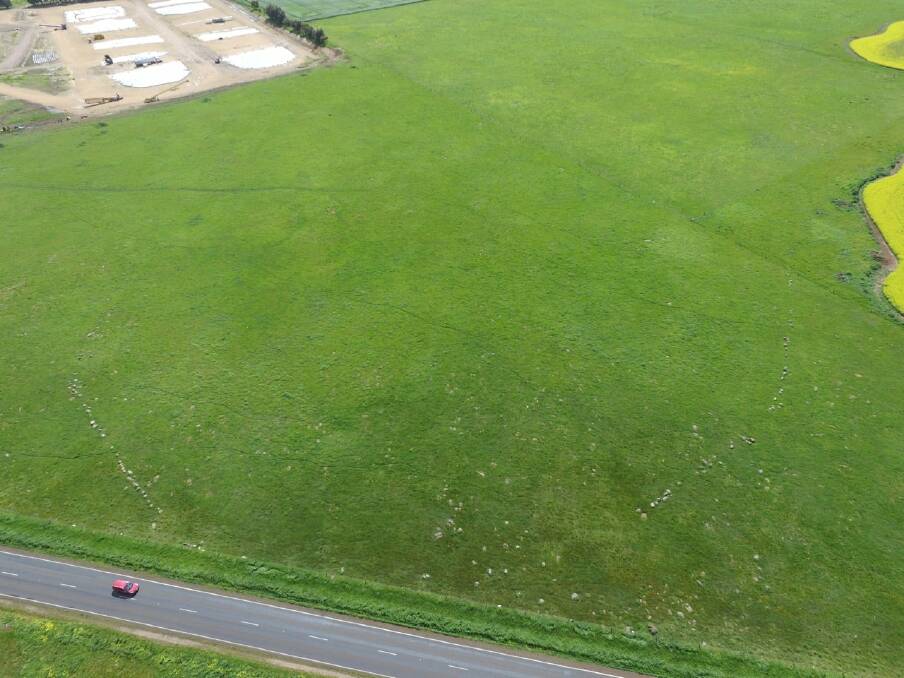 Visible from the air: The stones removed form a line near the red car. Picture: Neil Murray.