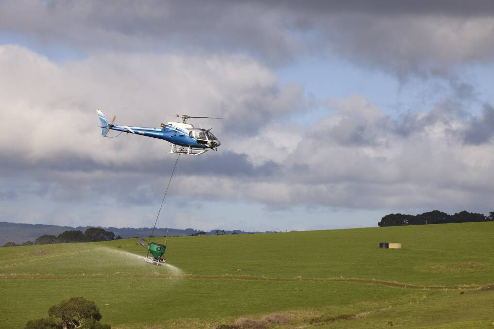 Helicopter pilot Rob Martin puts fertiliser out on a south-west farm.