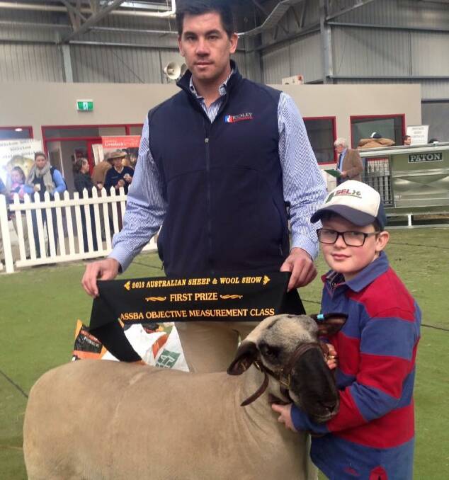 Wollondale Hampshire Downs' ram 680-15, held here by young Rex Sherwood, won the paternal sire class of the objective competition at last year's ASWS.