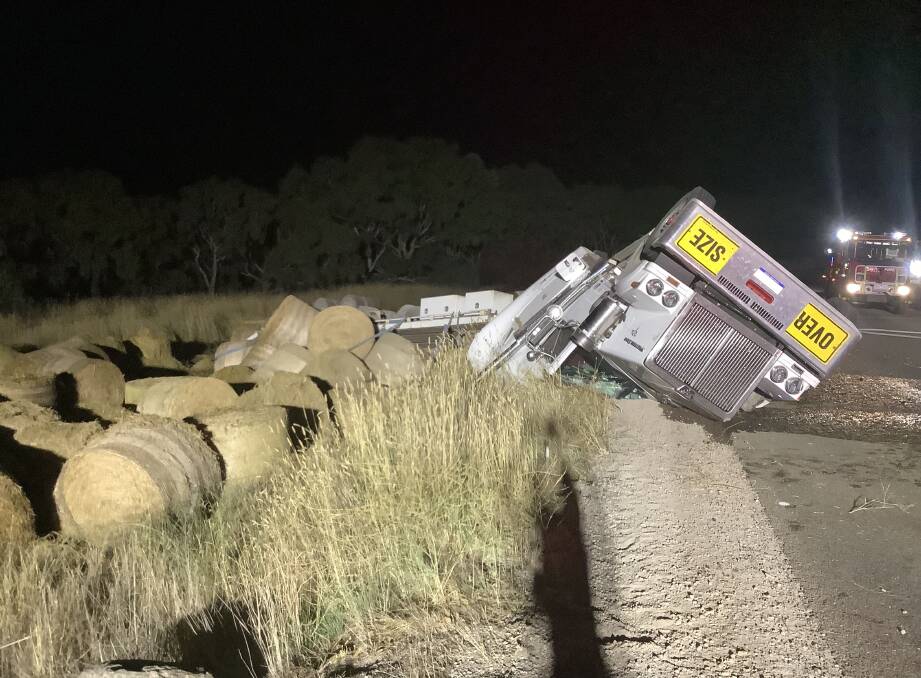 A prime mover carrying hay bales rolled on Thursday night with police saying the driver was 'extraordinarily lucky' to escape with only minor injuries. 