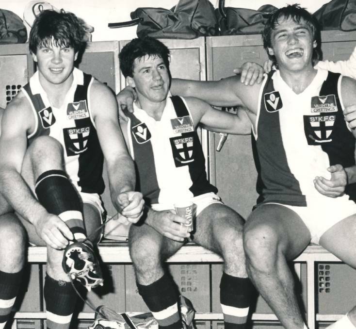 SAINTS COME MARCHING IN: Ballarat exports Danny Frawley with Peter Kiel and Tony Lockett after a St Kilda win in 1984.