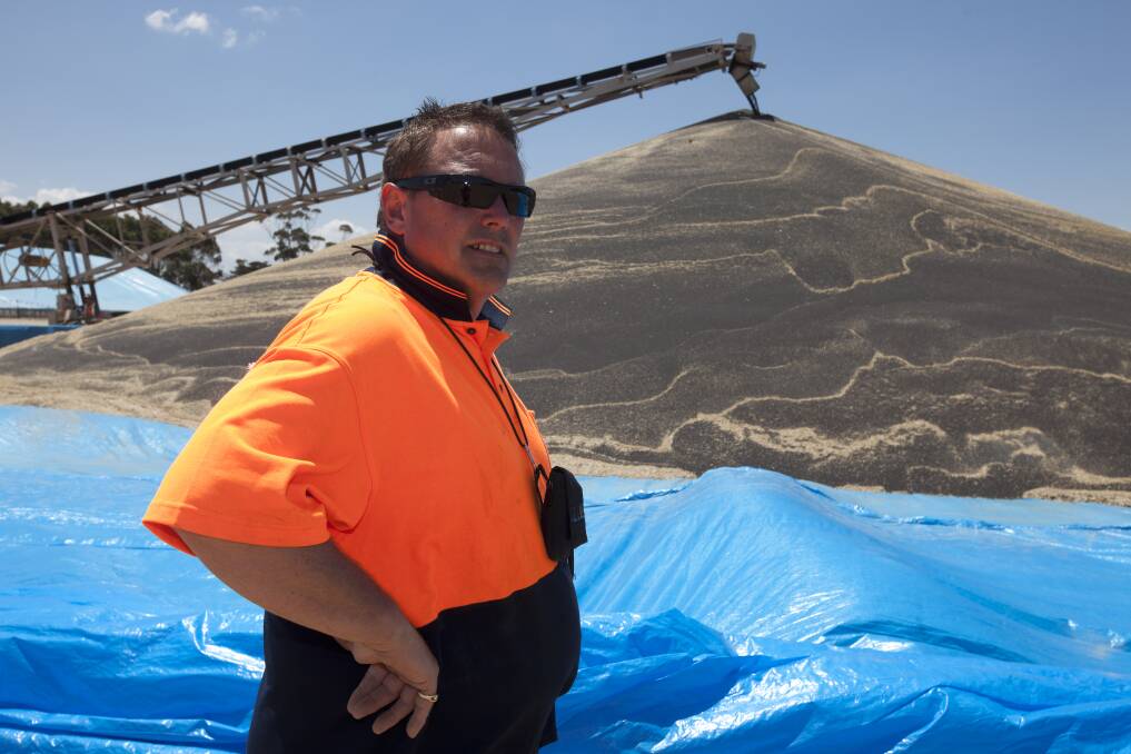 Greg Tait pictured in 2011 at the Berrybank GrainCorp centre, supervising unloading of canola. 