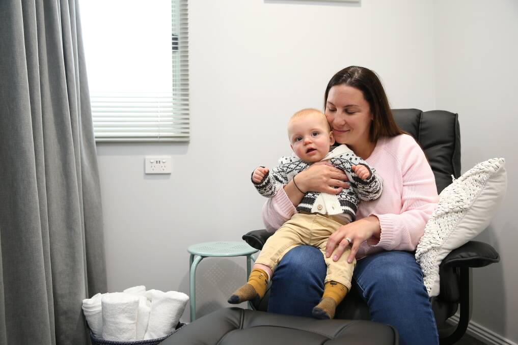 REMOVING BARRIERS: Bega worker Emma McElgunn with son Fred, 9 months, at the new breastfeeding room at Bega, Koroit. Photo by Mark Witte.