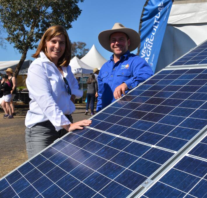 Commonwealth Bank of Australia’s NSW regional and agribusiness banking general Margot Faraci talks electricity efficiency ideas with Namoi Sustainable Energy principal, Will Lulhan, Tamworth at the recent AgQuip field days in 2017.