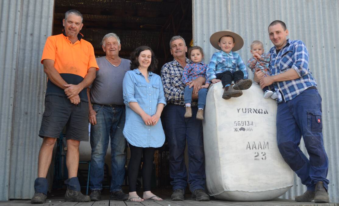 FAMILY: Adrian Sartori and his father Ralph Sartori with the Ebery family - Tika, Rob Ebery with Marlowe, Elwood, Dawson and Nick Ebery recognising Ralph's 60 years of working in the shed.