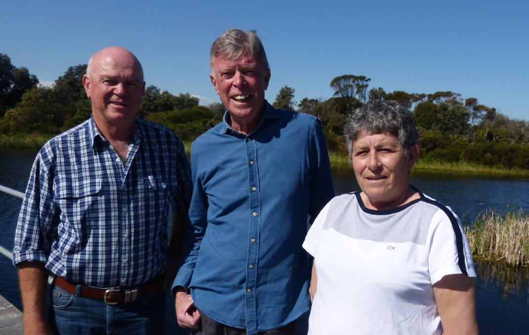 FRIENDS: Retired agent Rod Draper with the late Yancowinna principal, Dennis Ginn, and wife Christine Gicquel at the Yancowinna wetlands at Cape Paterson in October last year.