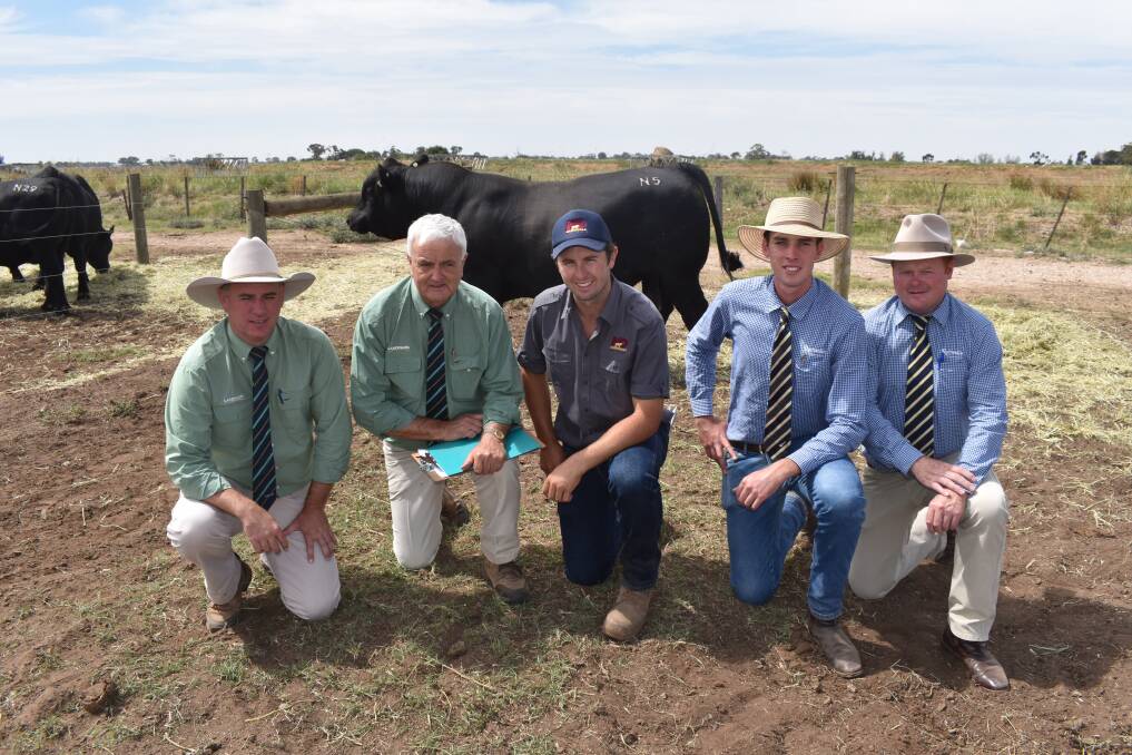 TOP: With the top priced bull at $22,000 were Landmark stud stock auctioneer Peter Godbolt, Landmark stud stock Ray Attwell (who took the phone bid), Brodie Collins, Merridale Angus, Tennyson, James Wilson, Rodwells, Bendigo, and Adam Mountjoy, Rodwells livestock manager.
