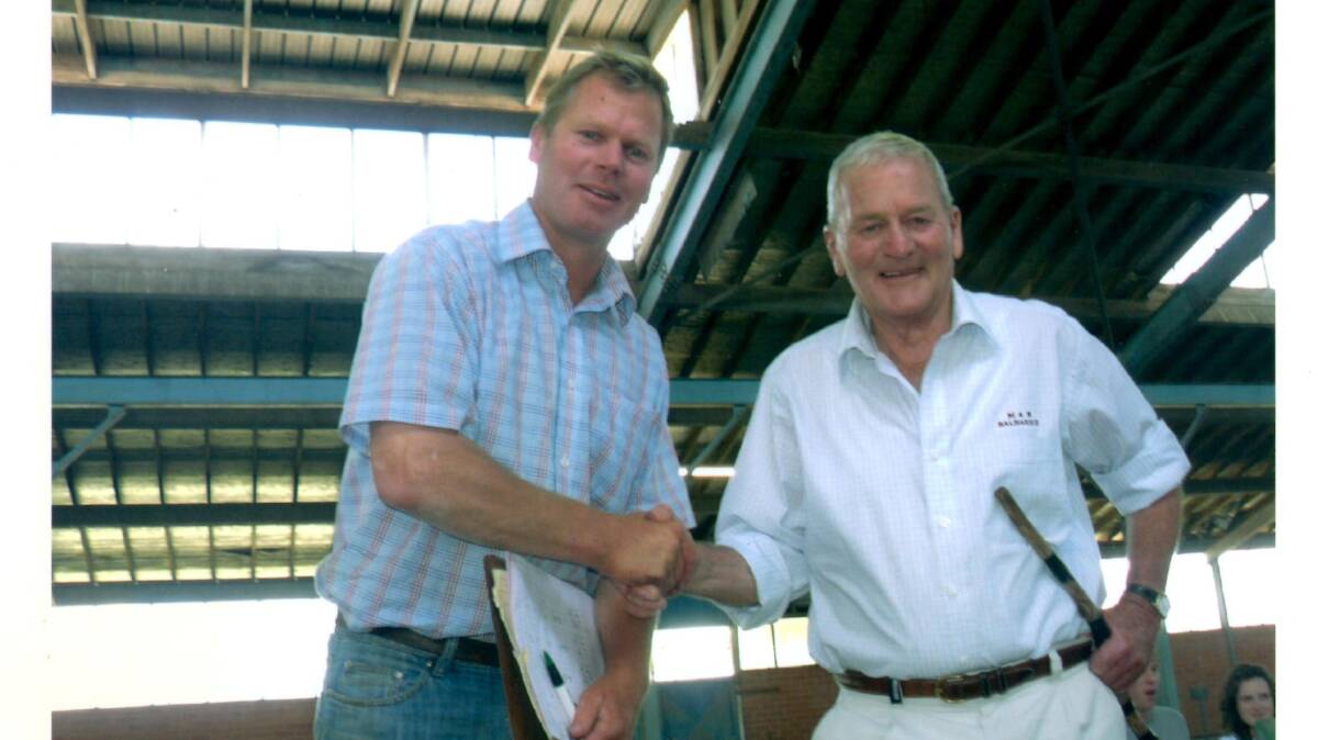 LAST SALE: Bruce Balharrie, with his late father Max in 2007, has been recognised as a perfectionist. Photo supplied.