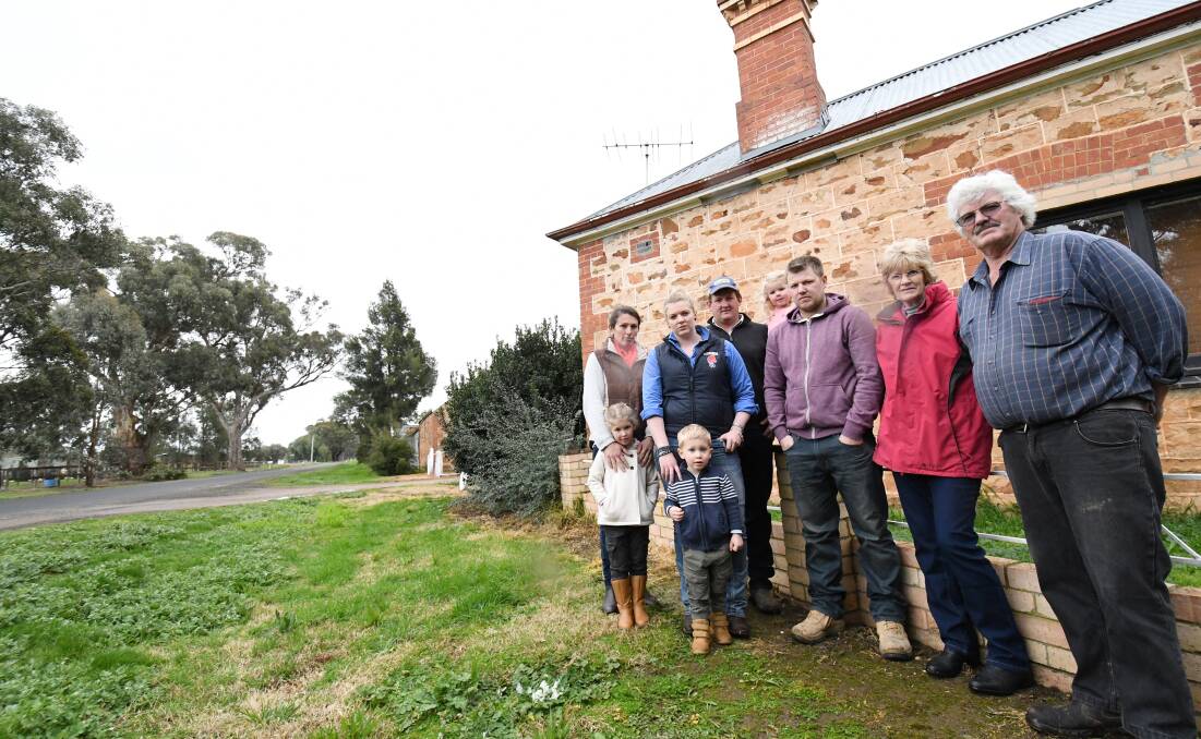 LAND: The Carter family -  Pauline and Max (right) with daughter-in-law Rosemary and grand daughter Rachel, daughter Tamrie and grandson Maximus, son Christopher and granddaughter Heidi, and son Heath.