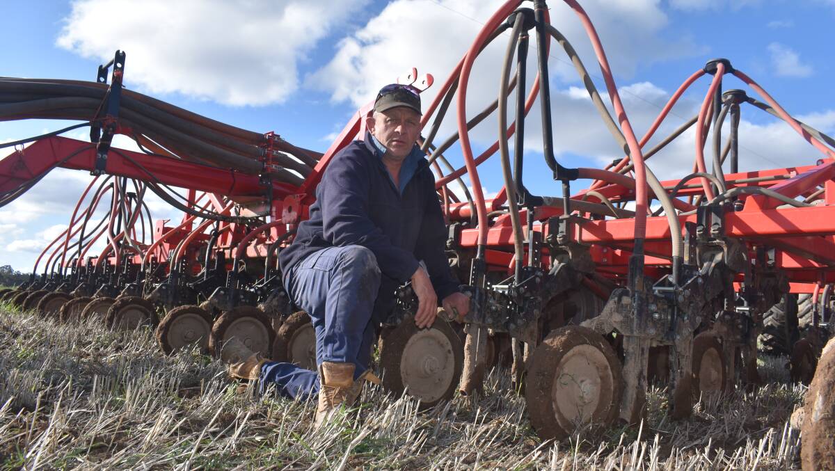 NEARLY DONE: Craig Mortlock checks the conditions after 18 milimetres of overnight rain on a block at Bet Bet north of Maryborough.