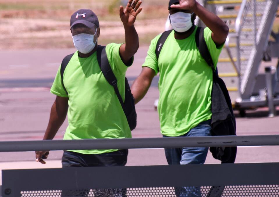 OVERSEAS: Workers from Vanuatu arriving in Darwin late last year.