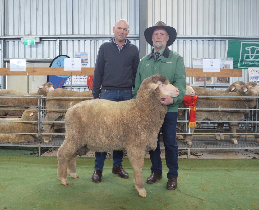 Interstate: Warren Russell, Melrose and Landmark wool account manager, John McGrath, Ararat, who bid to $4400 for the second top ram.