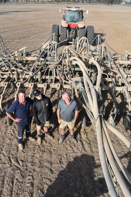 THREE GENERATIONS: Shane Bibby, Navarre, son Jaxon, and father Chris started sowing on April 8 and are well into their cropping program of 2100 hectares.