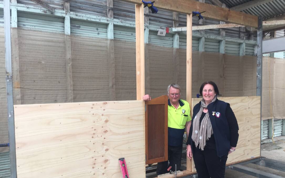 Shearing hub: Ballarat Agricultural and Pastoral Society caretaker, Stuart Rowe, and executive officer, Lucy Quartermain, during the construction of a shearing working display and honour board for this year's show.
