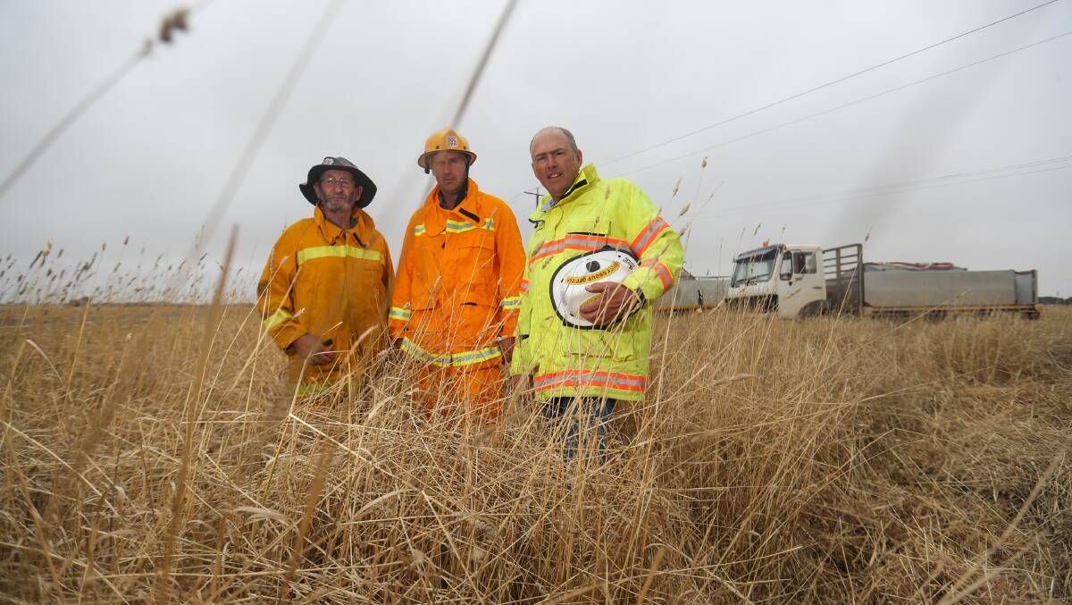 BLOCKED: Caramut CFA volunteers Geoff Howley, Aaron Pascoe and Bobby Mann were prevented from completing a roadside burn due to CFA operating procedure rules. Picture: Morgan Hancock.
