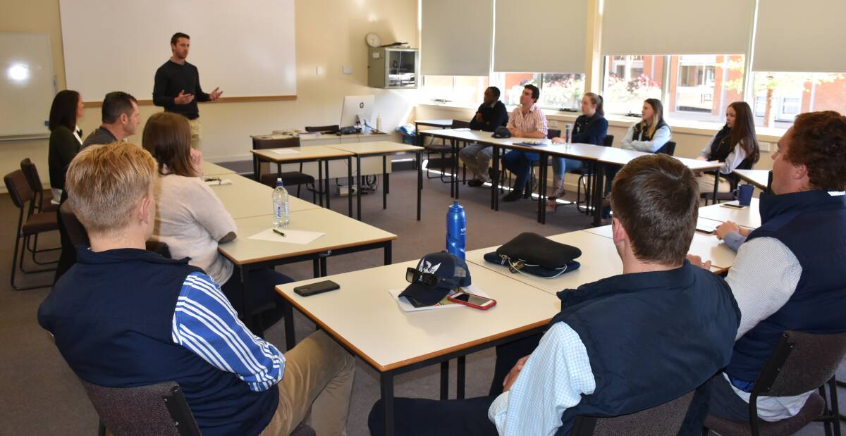 Stock & Land editor Tyson Cattle addresses the group of 13 Marcus Oldham College students about the agricultural industry and the media. 