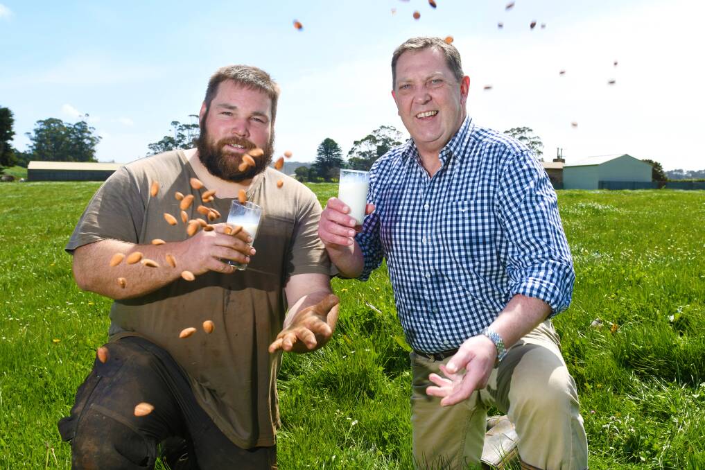 MILKING IT: Dairy farmer Simon Elphinstone and Gavin Pearce MP hope labelling laws can protect meat and dairy from plant-based "pretenders". Picture: Brodie Weeding