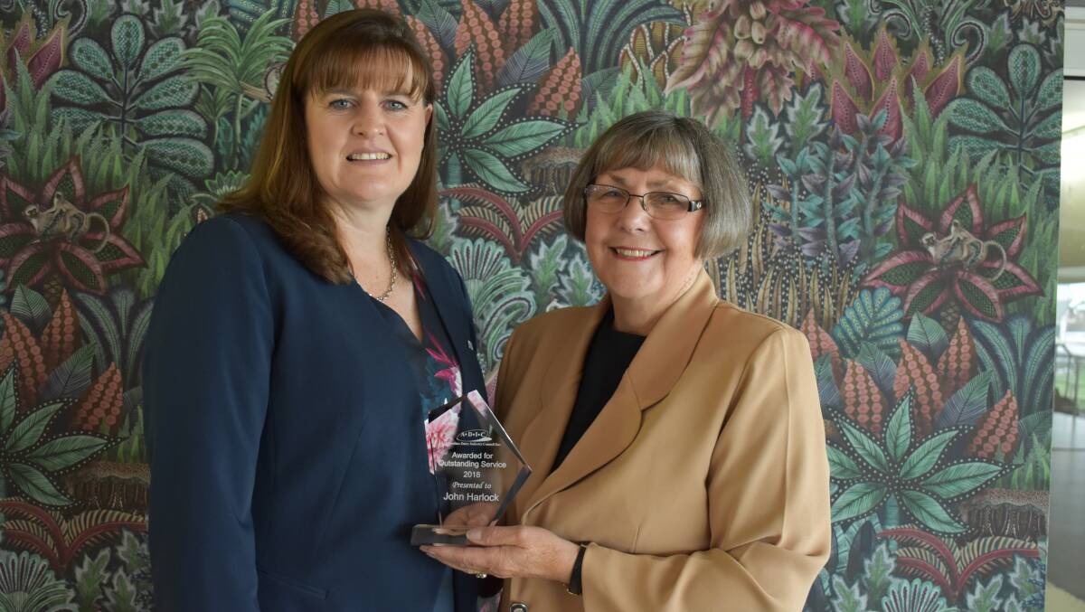ADIC director Simone Jolliffe with Shirley Harlock, who accepted the Pat Rowley Outstanding Service Award on behalf of her husband John.